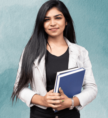 "Teacher standing with books in hand, ready to guide students in their learning."