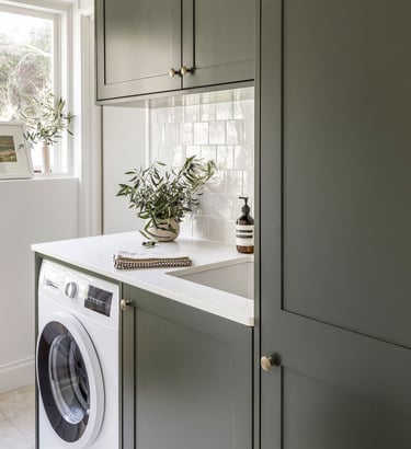 Custom built laundry cabinets by Silva Cabinetry