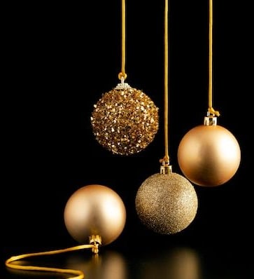 christmas ornaments hanging from a gold chain
