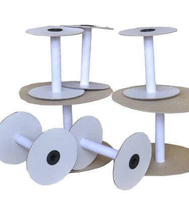 a paper bobbin spool with paper rolls of paper
