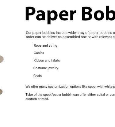 a paper bobbin spool with paper rolls of paper