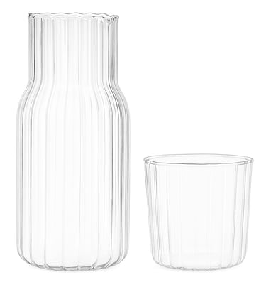 Glass carafe and matching tumbler set on white background