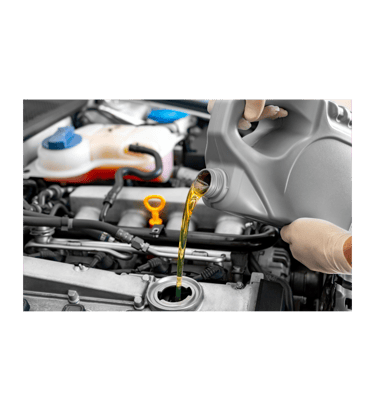 a person is pouring oil into a car