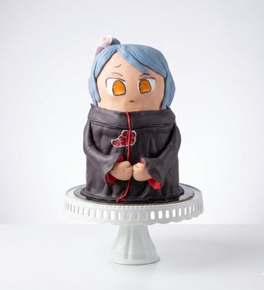 Torta temática estilo anime elaborada por Cocina con Ely, diseñada en formato 3D y decorada con figu