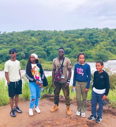 Professional safari guide with tourists during a Murchison Falls National Park trip in Uganda.