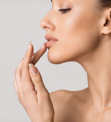 a woman touching her lip