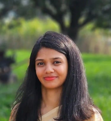 A front-facing portrait of the meditation facilitator.