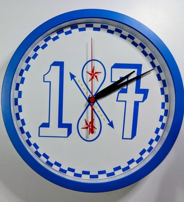 A blue and white round wall clock featuring large numbers 1 and 7 with a decorative red star design.