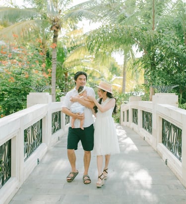 xFamily walking on resort bridge during Sofitel Nusa Dua Bali family photography session