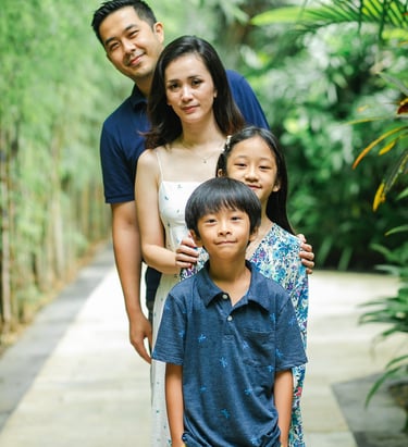 family portrait in tropical setting at Westin Nusa Dua Bali during natural photography session