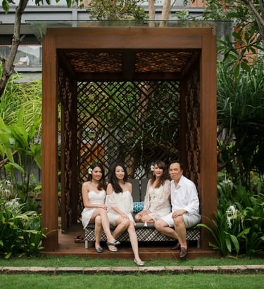 Janice family portrait at Indigo Seminyak Bali surrounded by tropical garden scenery
