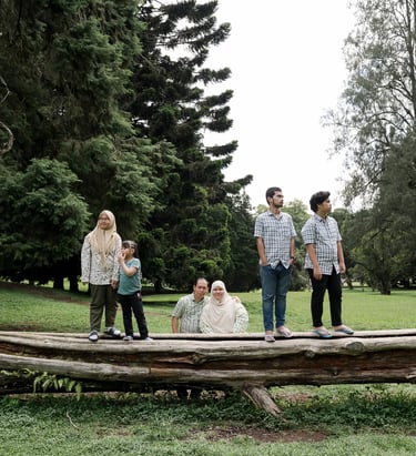 Iqbal family walking together during an outdoor family photography session at Botanical Garden Bedugul.