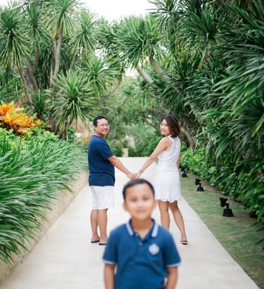 Child portrait with parents in background at The Mulia Nusa Dua Bali