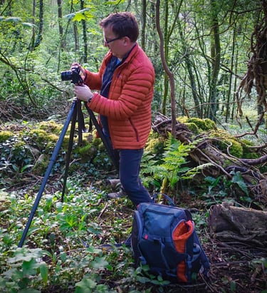 Paul Binnion Nottingham Photographer setting up his camera in the woods