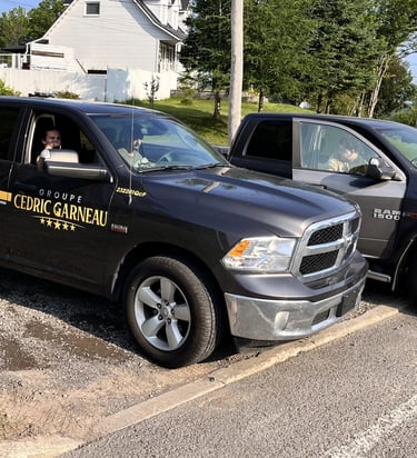 2 company trucks with employees