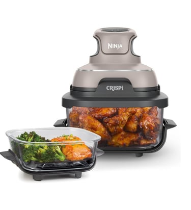 Ninja air fryer with chicken inside and broccoli with salmon in another container