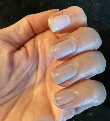 One coat of sheer nail polish giving a clean, natural, healthy looking finish on the nails.