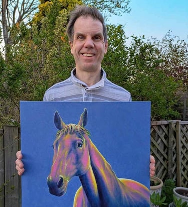 Charles Hooren - animal portrait artist holding a canvas painting of a horse
