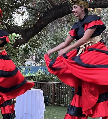 Noelani Jeffery and Bri Xandrick on stilts for Aerialogists