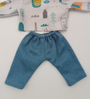 Colourful dolls top with denim blue trousers