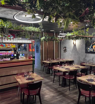 a restaurant with a bar and tables
