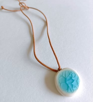 The Eden Holistic Health Studio, Gift Shop, Porcelain and Leather Thong, Turquoise Pendant.