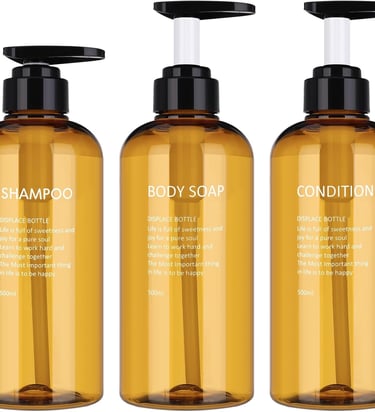 three bottles of body washer with a bottle of shampooe