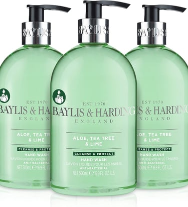 three bottles of bath soap with a bottle of liquid