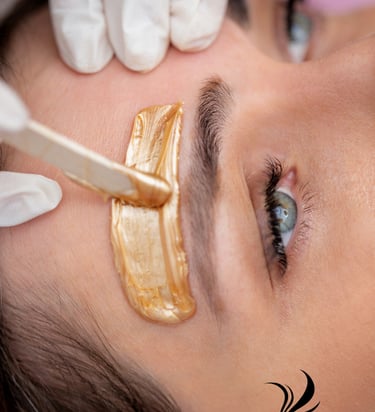 a woman with a gold eyeliners and a gold eyeliners