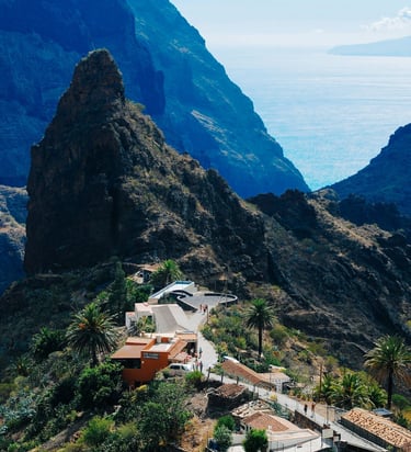 Masca mountain village among rocky cliffs and green valleys.