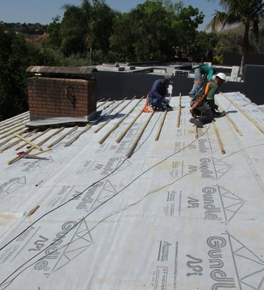 Underlayment set out for roof replacement project in Hyde Park, Sandton, Environmental Pro Construction