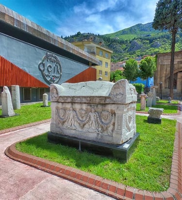 Ancient Roman sarcophagus and artifacts on display at the Amasya Archeology Museum in Turkey.