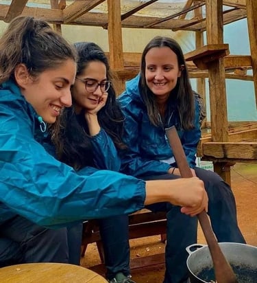 Happy travelers wearing blue rain jackets during a guided tour or outdoor adventure group trip