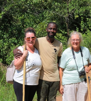 Professional safari guide with tourists during a Murchison Falls National Park trip in Uganda.