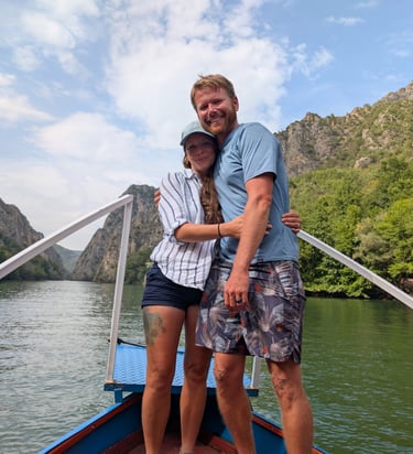 Don and Samantha on the bow of a boat in Matka Canyon in North Macedonia 