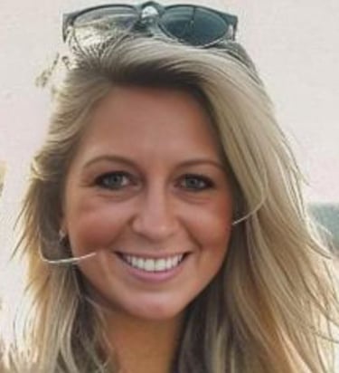 a woman with sunglasses on her head