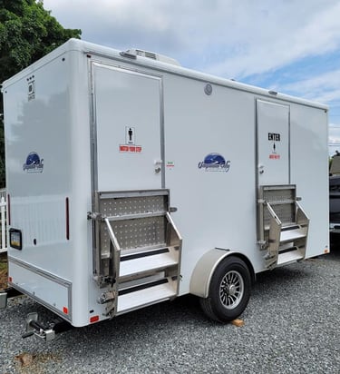 a 2 stall luxury restroom trailer heading out to an event being hauled with a truck