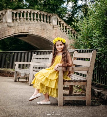 Girl sitting on bench by bridge – Fred Art Studio outdoor photography
