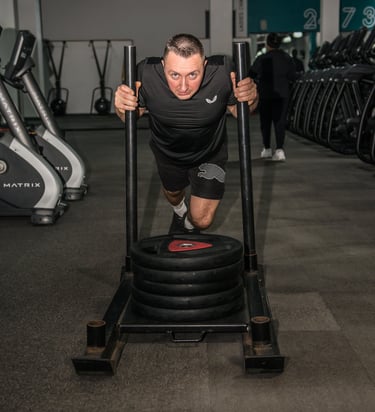 Trainer is doing a pull up barbell