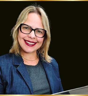 a woman with glasses and a blue jacket