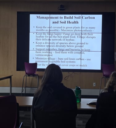 Presentation slide showing management practices to build soil carbon and soil health during a workshop.