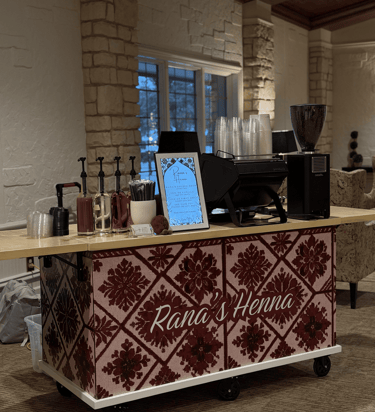 Custom wrapped mobile coffee cart featuring traditional tatreez embroidery pattern for Dallas events