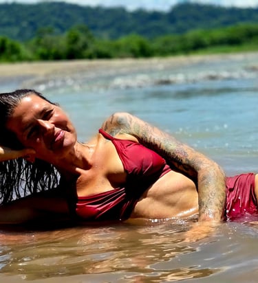 a woman in a bikini laying in water