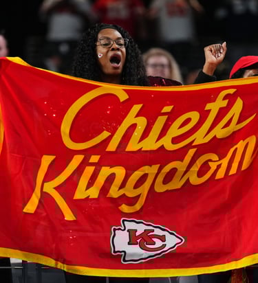 Kansas City Chiefs Fan holding "Chiefs Kingdom" Flag