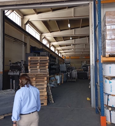 a man walking through a factory