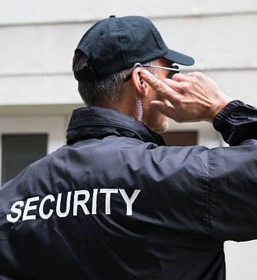 a security officer talking on the phone