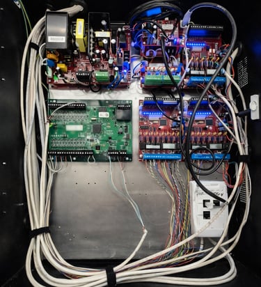 Commercial access control and power distribution panel with neatly routed wiring.