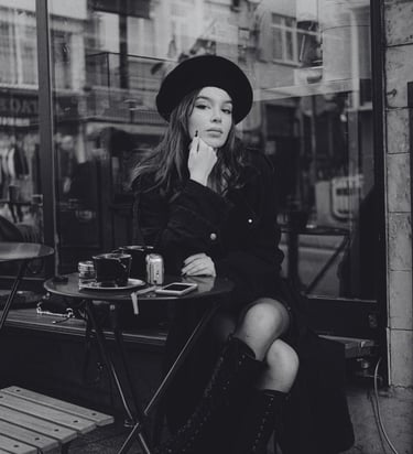 An Introvert sitting alone at a cafe thinking about how to date as an introvert