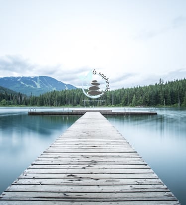 a dock with a wooden dock and a mountain in the background