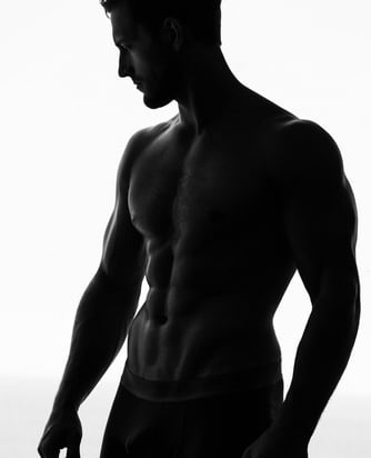 a man in a black and white photo of a man in underwear